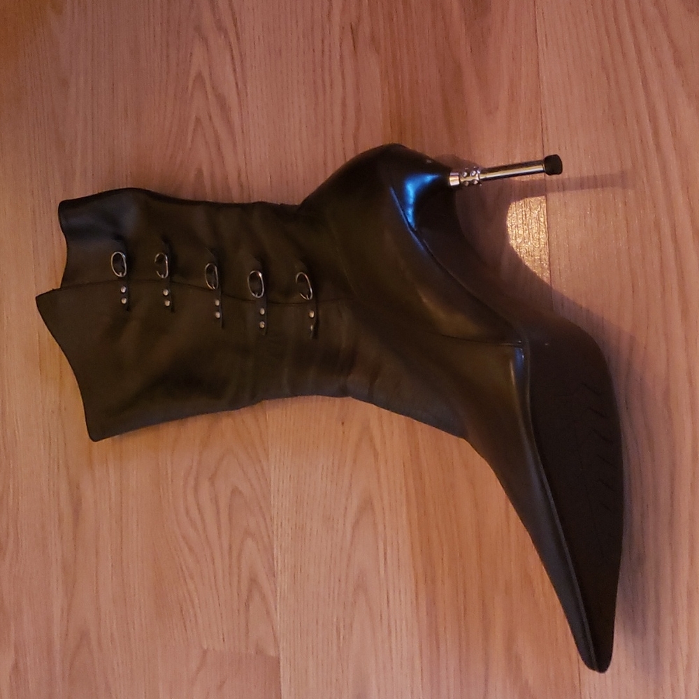 Black high heel stiletto boots a little below mid calf